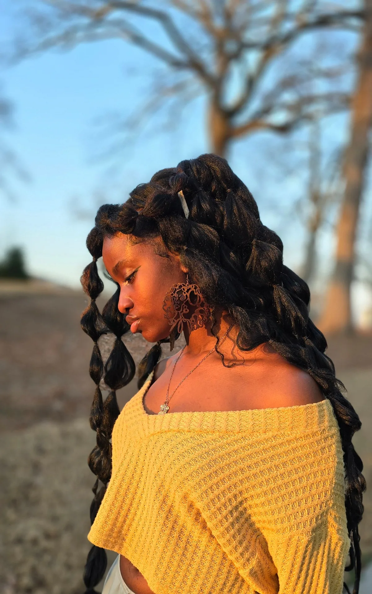 Model wearing Mak Quinn earrings